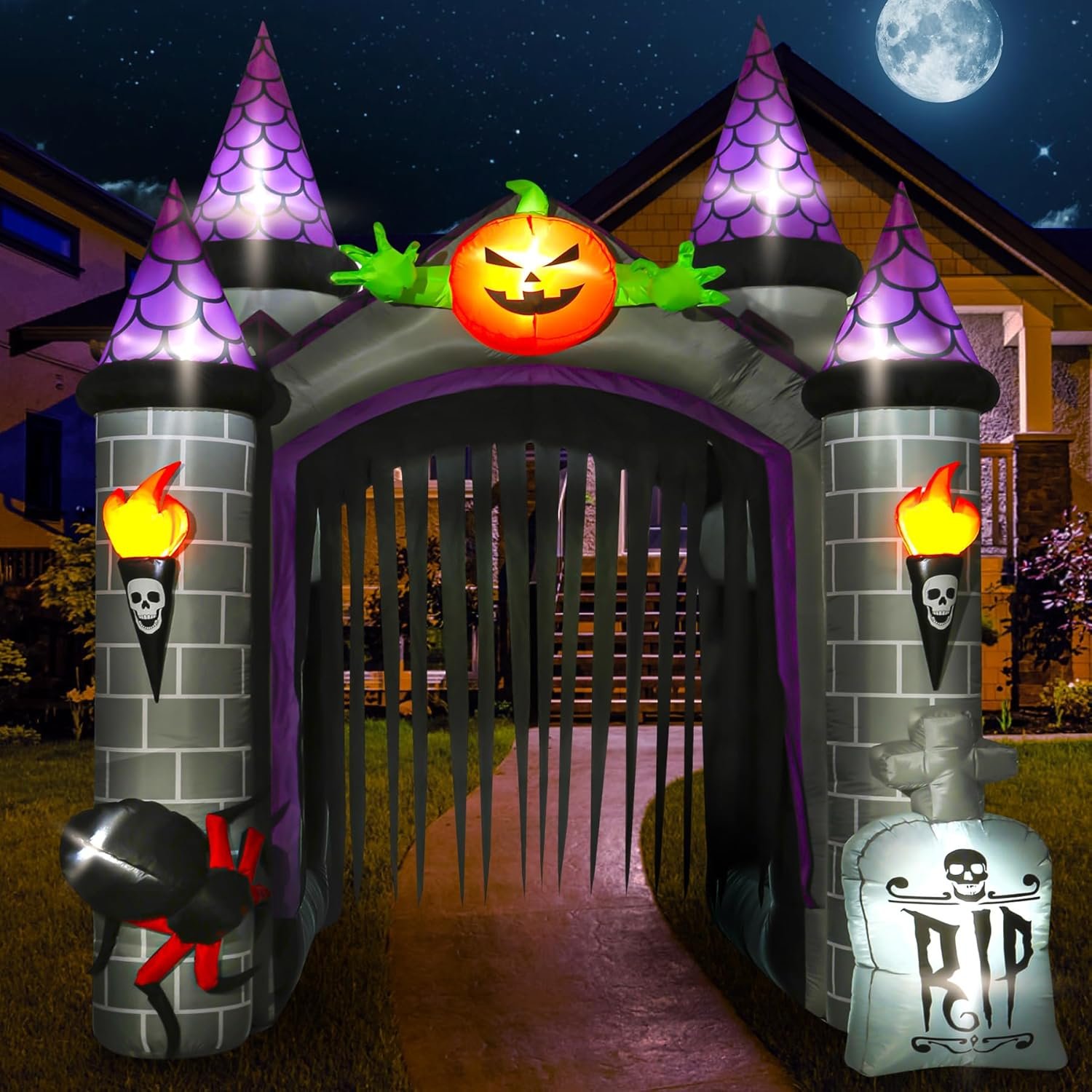 welve-foot inflatable Haunted Pumpkin Castle archway lit up in a yard at night.