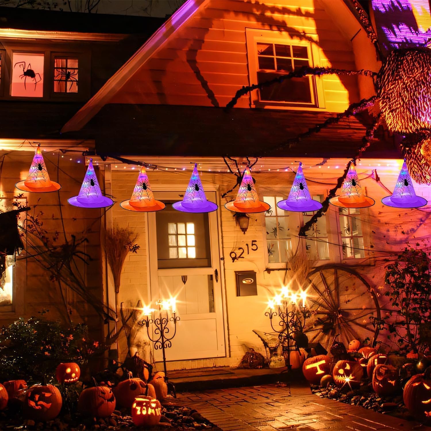 Decorative hanging lighted witches hats for Halloween.